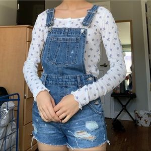 Distressed short denim overalls